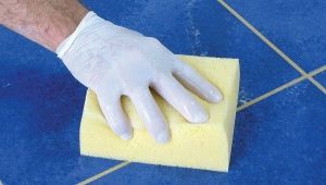  How can I scrub the grout from the tile?